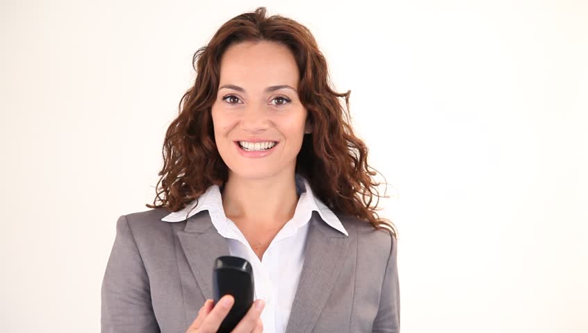 Businesswoman dialing telephone number