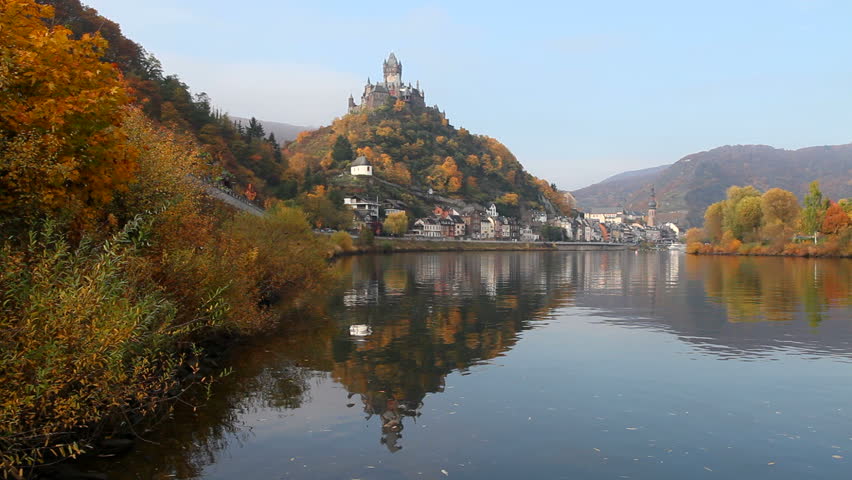 Panorama of the town Cochem on the river Moselle in Germany, with the Reichsburg castle on the hill. Beautiful autumn colors.