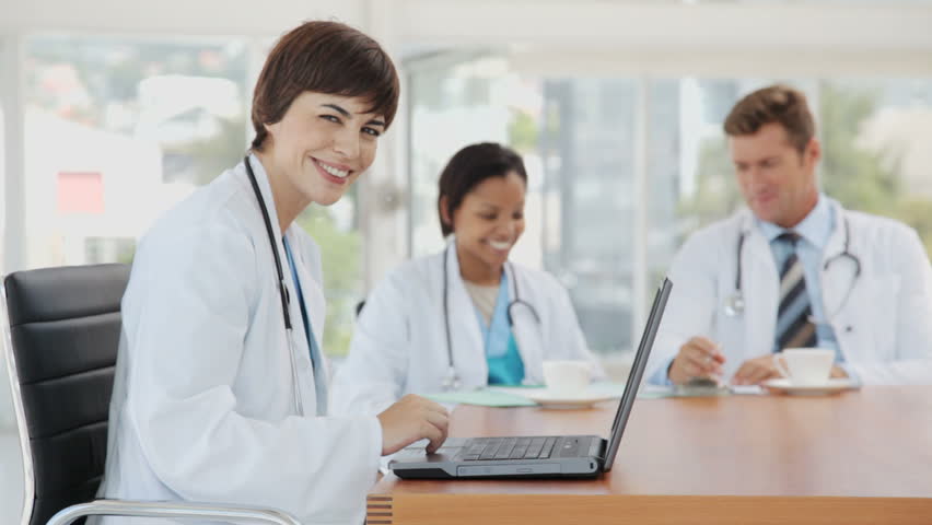 Female Doctor Posing with her Laptop