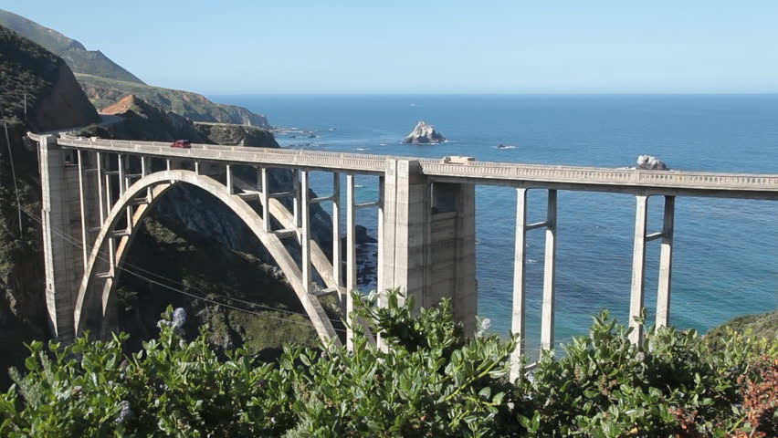 Bixby Creek Bridge with cars crossing, but includes time with no traffic visible; Big Sur area of Central California.