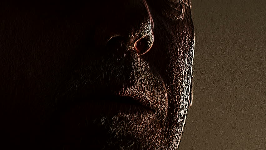 Very wrinkled man smoking a cigar