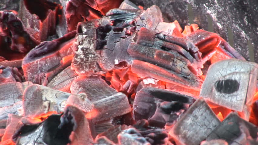 Coals burning in a BBQ, closeup