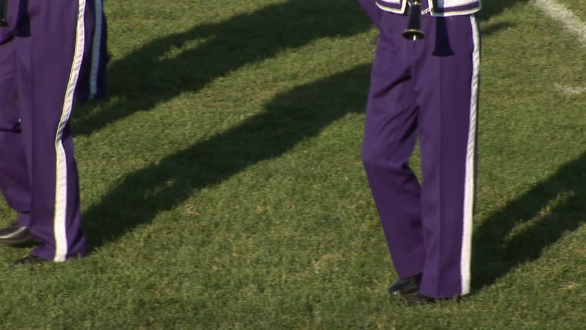 Marching feet of purple & white band