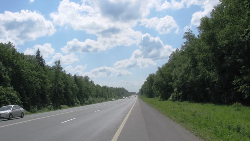 KIEVSKOE HIGHWAY, RUSSIA - JUNE 1: Movement on Russian route M3 (Ukraine Highway or Kievskoe highway) on June 1, 2010 in Russia. M3 is major trunk road from Moscow to border with Ukraine.
