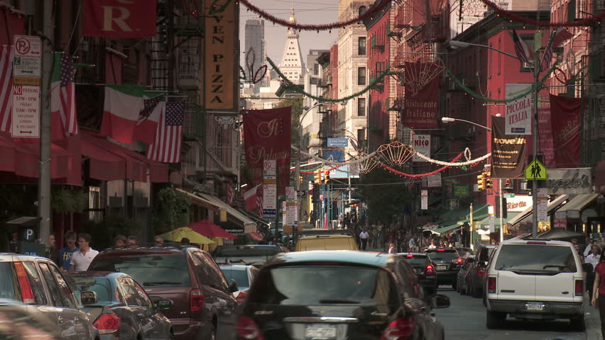 NEW YORK CITY - AUGUST 10:  A busy street corner in Little Italy on August 10, 2010. In 2010, New York City's Little Italy and Chinatown were listed in a single historic district on the National Register of Historic Places.