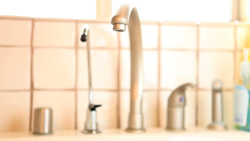 woman rinsing hands
