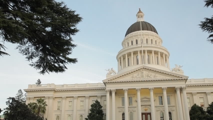 Pan of the state capitol building in Sacramento, California, just after sunset.