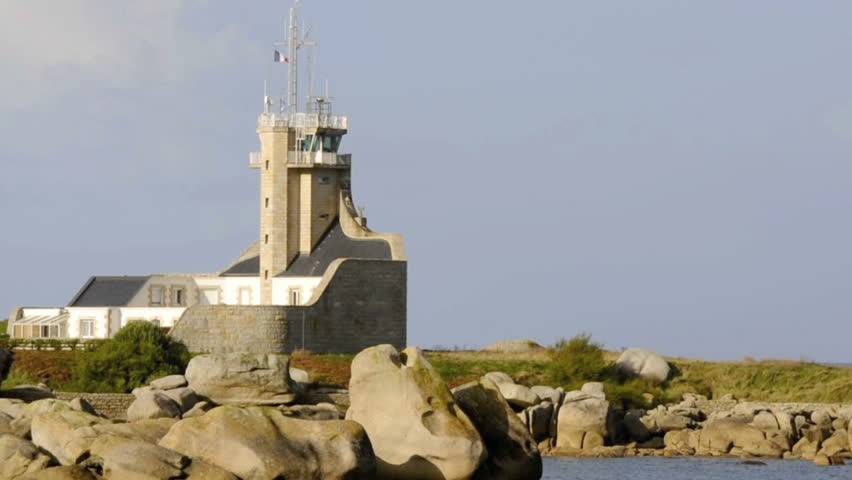 Lighthouse on a sunny day at the Pointe du Pontusval in Kerluon, Brittany, France.