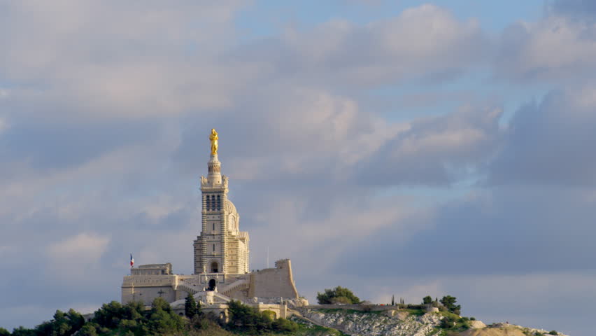 long timelapse of clouds gathering over the notre dame de la garde church in marseille, france