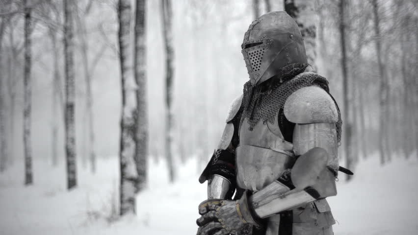 Portrait Of Medieval Warrior Putting On Steel Helmet While Kneeling ...