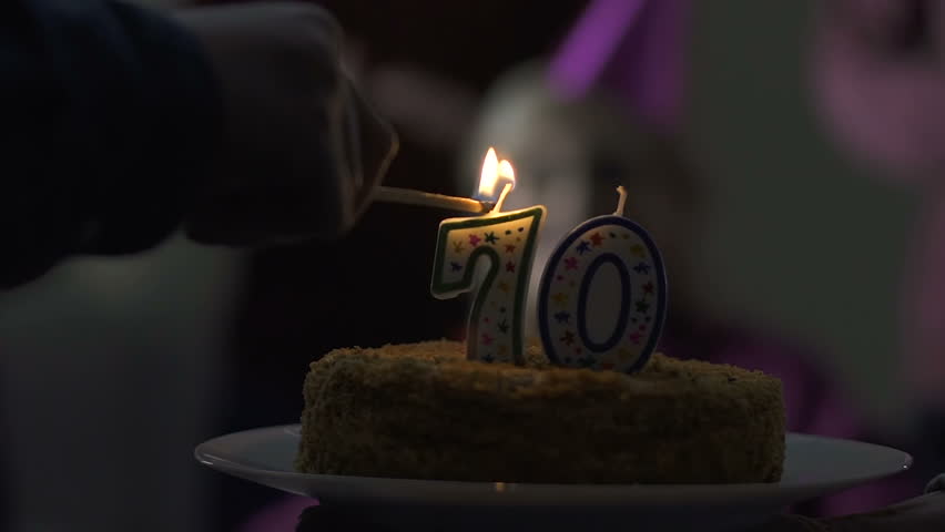 Hd00 15happy 70 Years Old Woman Blowing Out Candles On Birthday
