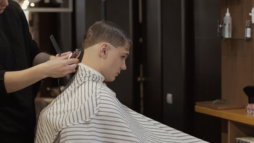 Barber Cuts Guys Hair With Stock Footage Video 100 Royalty Free