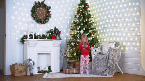 Girl Decorate Christmas Tree In Stockvideos Filmmaterial
