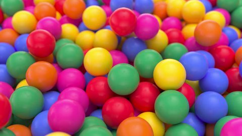 4k 3D animation of a pile of abstract colorful spheres and balls, rolling and falling.