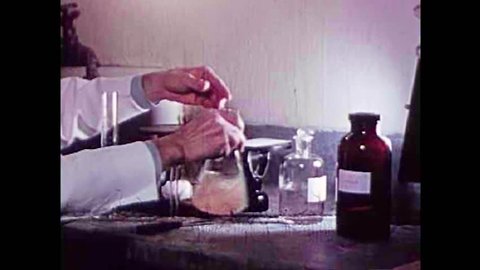CIRCA 1940s - Pork is artificially digested to test for the parasite Trichinosis in the 1940s