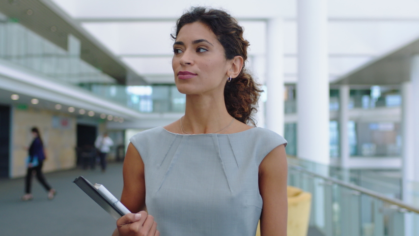 confident business woman walking in airport smiling independent female executive enjoying successful corporate career 4k footage