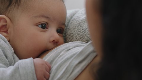 480px x 270px - Mother breastfeeding baby at home mom nursing infant nurturing child  suckling milk from breast motherhood maternity care