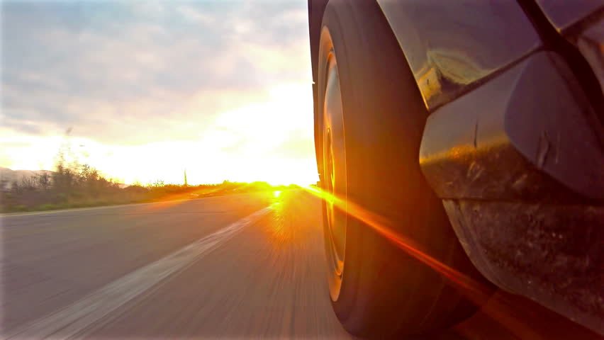 Car Goes On Bilateral Road On Sunset, Sunrise Low Angle Highway Race ...