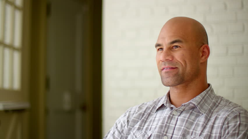 Handsome Mixedrace Bald Man Sitting, Stock Footage Video