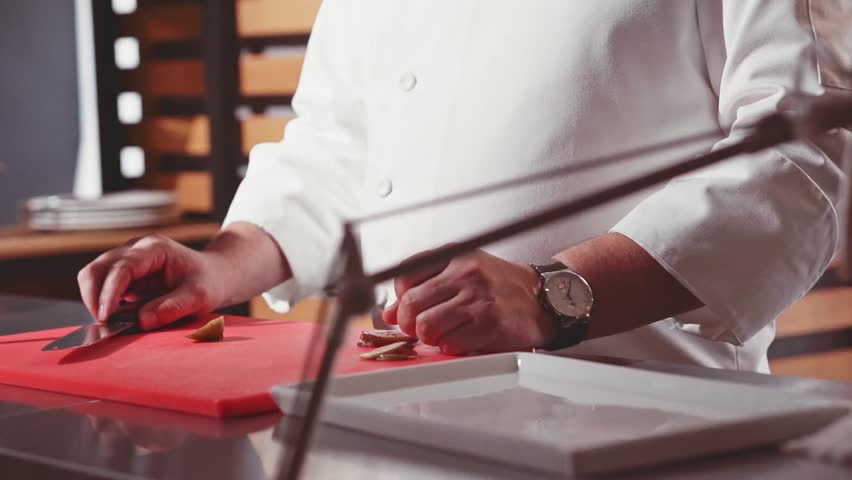 Restaurant Kitchen Video close-up of chef hands cooking and preparing in restaurant kitchen Restaurant Kitchen Video close-up of chef hands cooking and preparing in restaurant kitchen