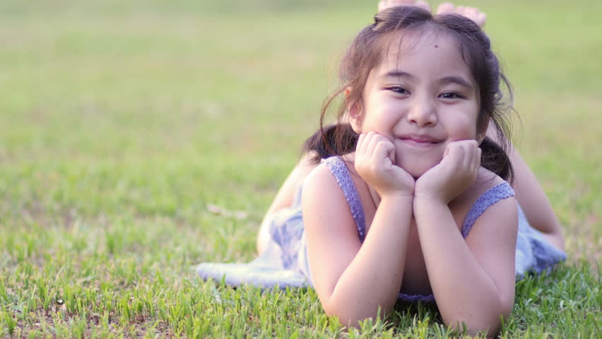 Young Beautiful Woman Smiling Lying In Grass In Summer Dress Outside At ...