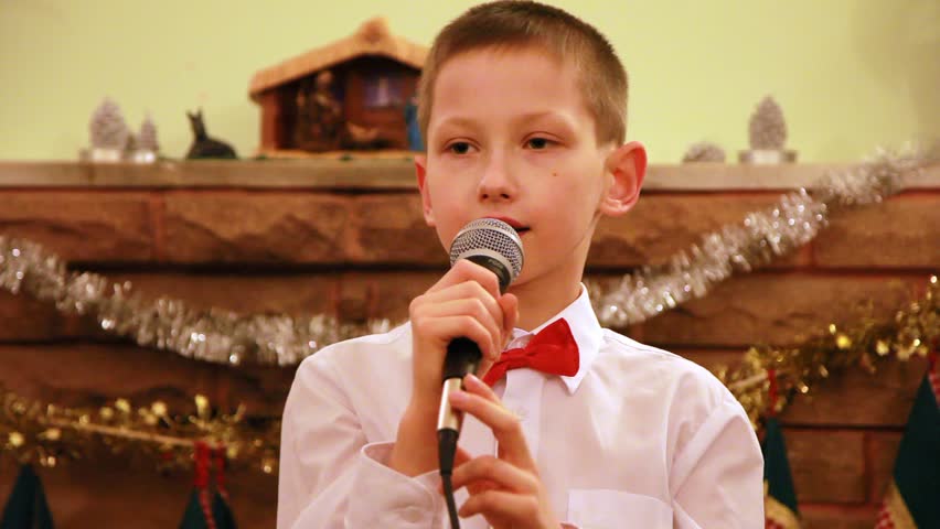 Hd00 13boy In Glasses Sings Christmas Song Into Microphone In