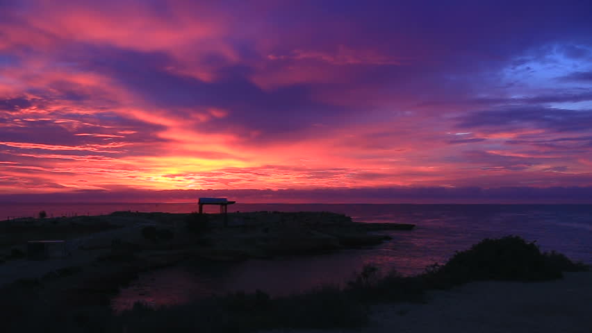 Stock Video Clip of bright beautiful purple-pink sunrise and the sun ...
