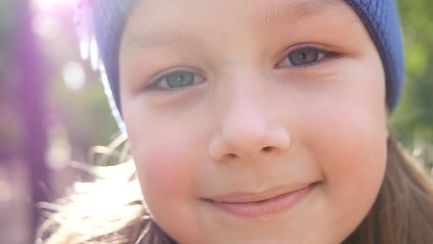 little kid girl cute smiling face closeup looking at camera outdoors hd stock video clip - Little Kid Pictures little kid girl cute smiling face closeup looking at camera outdoors hd stock video clip - Little Kid Pictures
