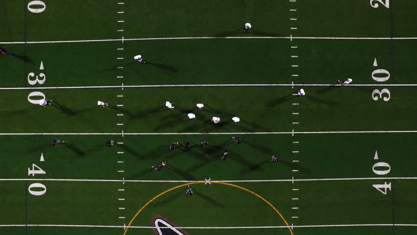 Stock video of two football teams getting into huddles | 12452417 ...
