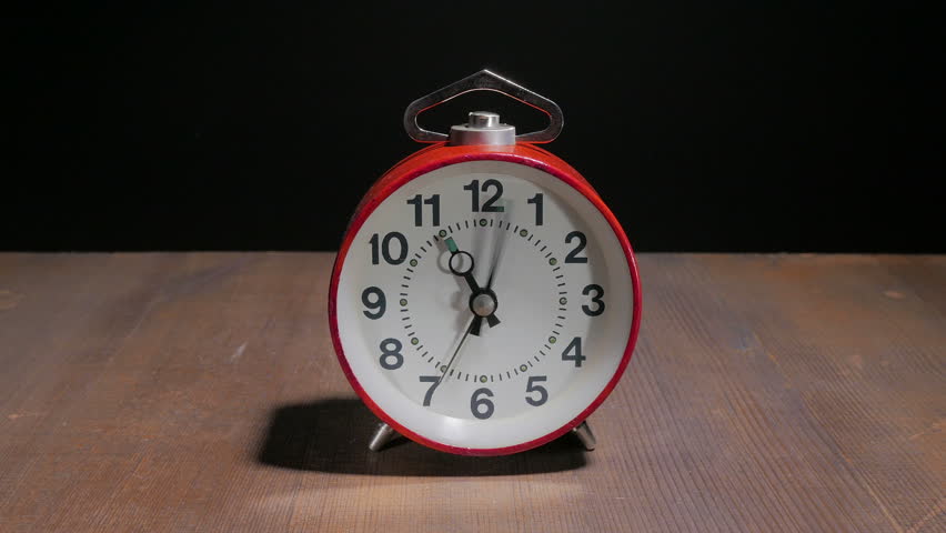 red alarm clock old fashioned