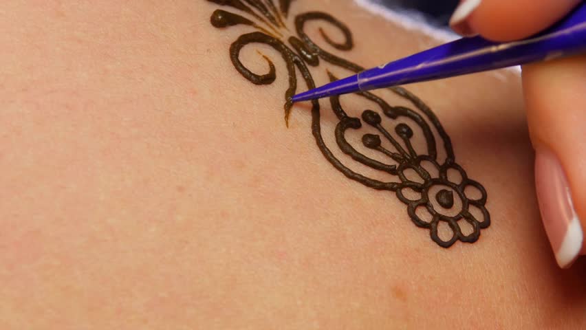 process of decorating woman back with henna tattoo mehendi on process of decorating woman back with henna tattoo mehendi on