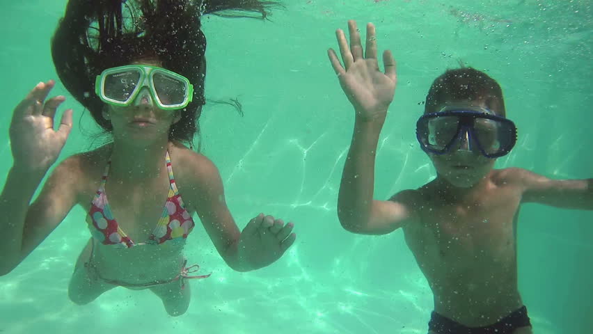 Kids Swimming Underwater three kids swimming in pool underwater stock footage video Kids Swimming Underwater three kids swimming in pool underwater stock footage video