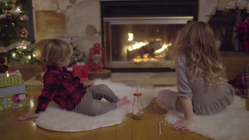 Little Kids Sit By Christmas Tree Watch Fire And Enjoy A Special