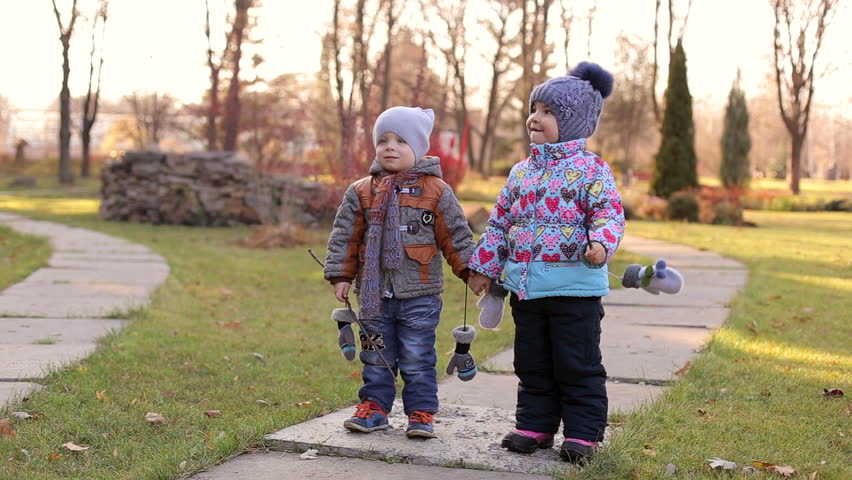 two small children walking in the park and someones call the name a child calls - Pics Of Small Children two small children walking in the park and someones call the name a child calls - Pics Of Small Children