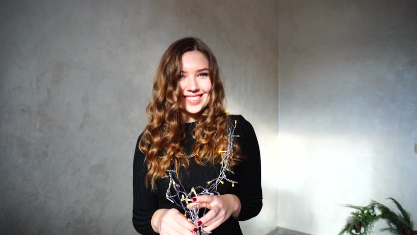 4k00 15girl With Long Curly Brown Hair Sitting In White Room With