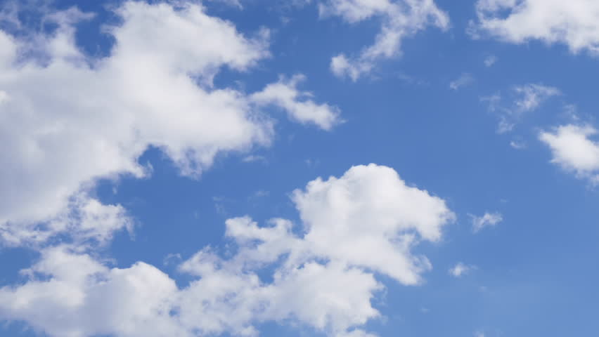 Time Lapse Clip Of White Fluffy Clouds Over Blue Sky Stock Footage 