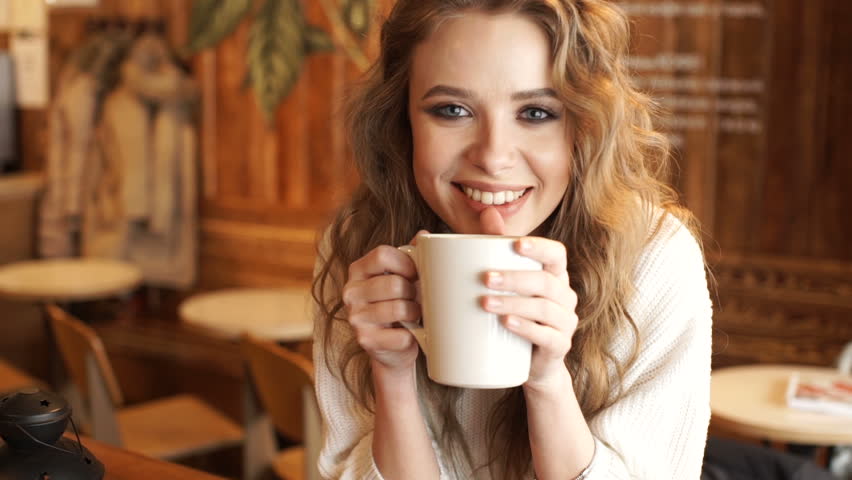 Pretty Girl Looking At Camera And Smiling. Beautiful Woman With Cup Of ...