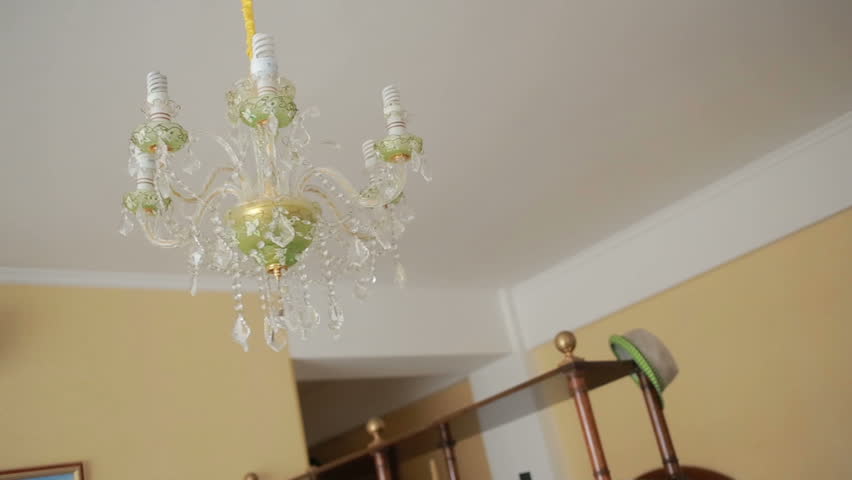 A Handsome Man Shirt Changes Light Bulb To Crystal Lamp Stock Chandelier Ceiling Lamp Swinging In The Event Of An Earthquake Hd Stock Footage