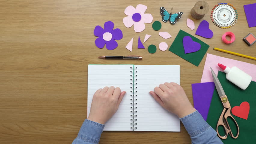 Overhead Top View Of Woman Writing Ideas In Diary At Desk Stock Overhead Lockdown Footage Of Woman Writing In Diary On Wooden Table Aerial Personal Perspective