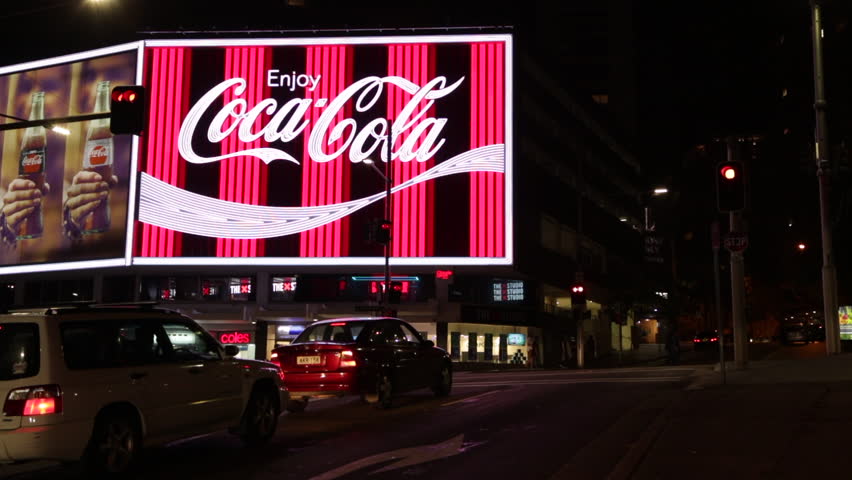 The Flashing Neon Sign Of The Coca Cola Billboard In - vrogue.co