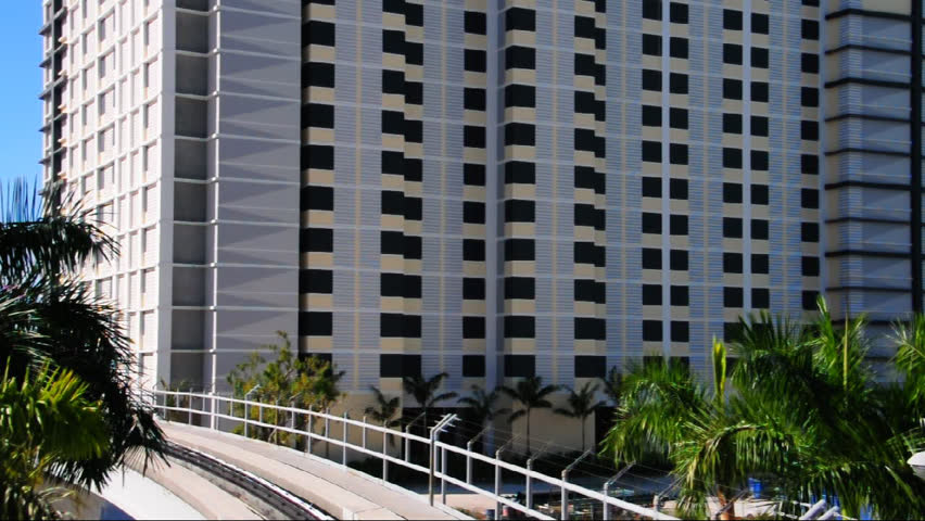 Apartment Building Front metromover train in miami approaching station in front of Apartment Building Front metromover train in miami approaching station in front of