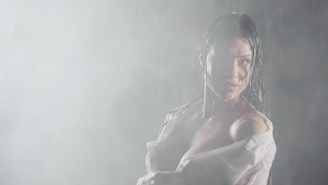 Hot Nude Orient Beach - Sexy girl semi nude covering his nakedness with white shirt in a thick fog  in the rain at night