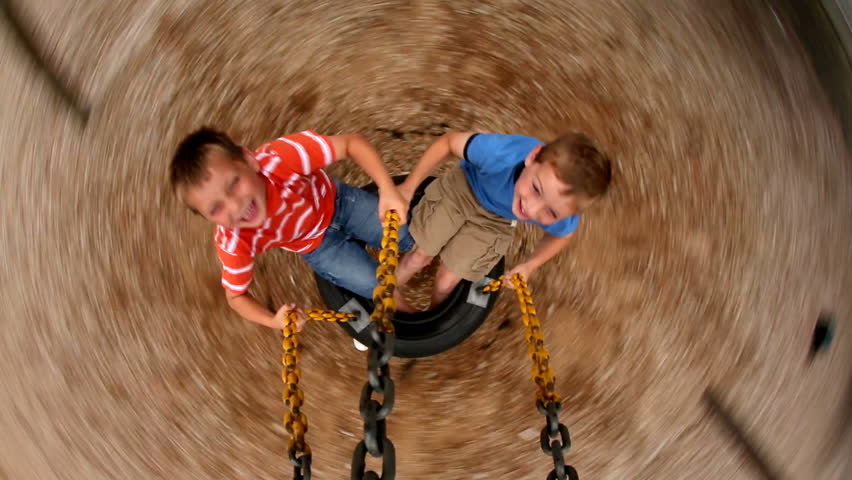 Two Young Boys Spinning Tire Stock Footage Video 100 Royalty Free 4584287 Shutterstock