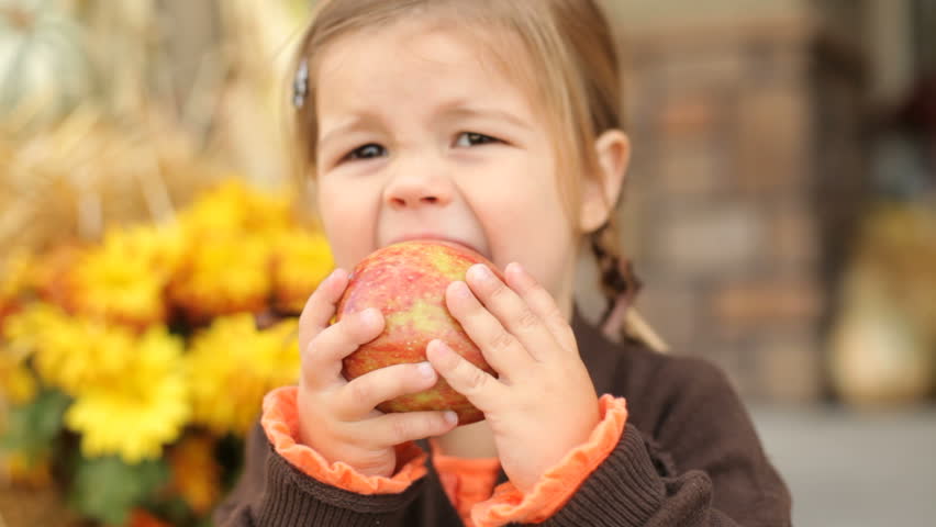 Girl Eating Apple Stock Footage Video | Shutterstock