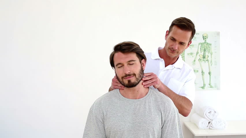 Physiotherapist Rubbing Patients Injured Neck In His Office At The ...