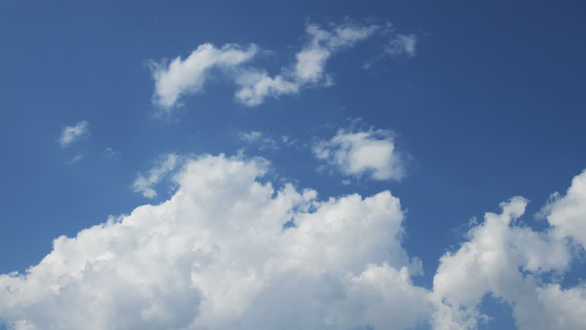 Time Lapse Clip Of White Fluffy Clouds Over Blue Sky Stock Footage ...