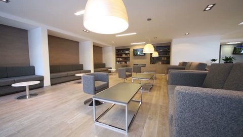 Rest Room With Sofas Tv And Bookcases At Modern Business Center