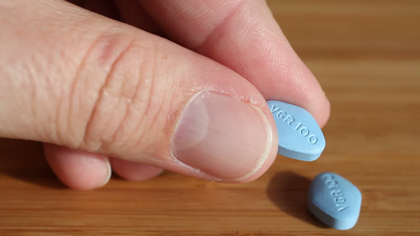 Kusadasi, turkey - january 20: viagra pills presented in a manâ€™s hand on  january 20, 2010 in kusadasi, turkey. viagra was developed by pfizer as an  erectile dysfunction drug.