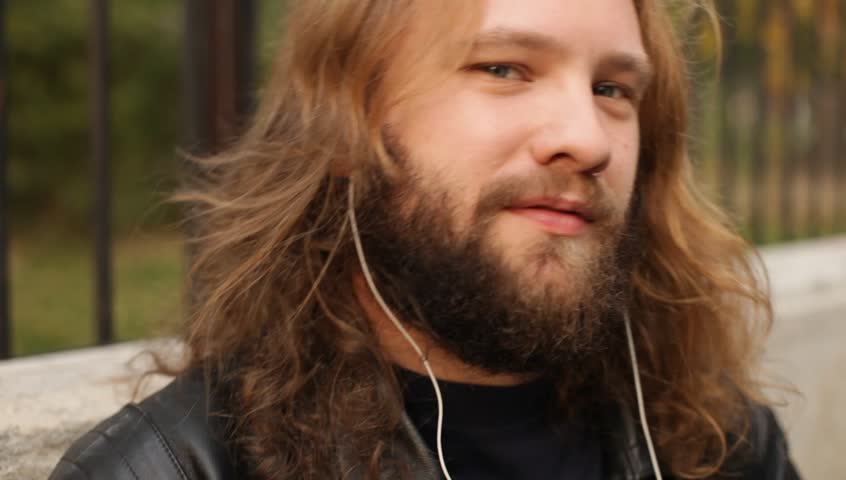 Blond Long Hair And Beard Young Adult Hipster Man Listening Music