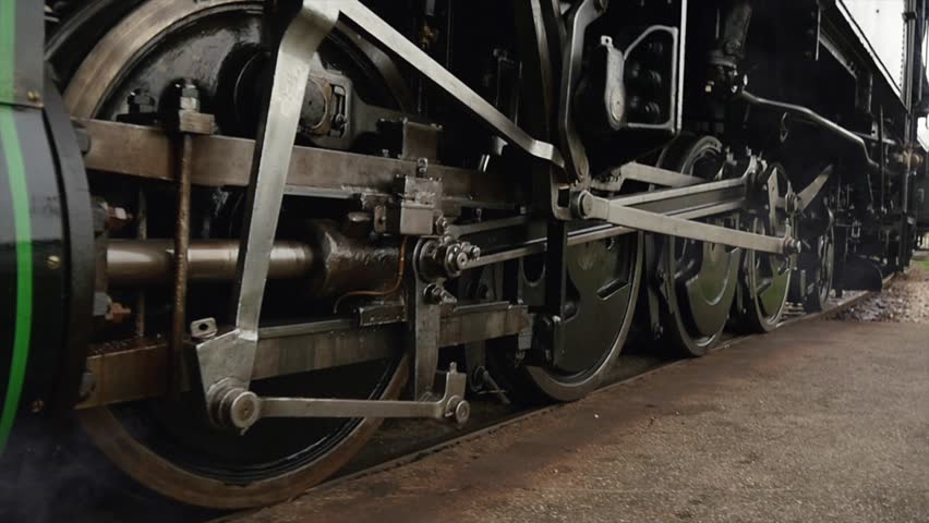 Heavy Industrial Steam Locomotive Train Engine Wheels Passing In Slow Motion. Stock Footage ... Heavy Industrial Steam Locomotive Train Engine Wheels Passing In Slow Motion. Stock Footage ...